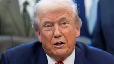 President Donald Trump speaks to reporters after signing a spending bill that ends a partial shutdown of the federal government in the Oval Office of the White House, Tuesday, Feb. 3, 2026, in Washington. (AP Photo/Alex Brandon)