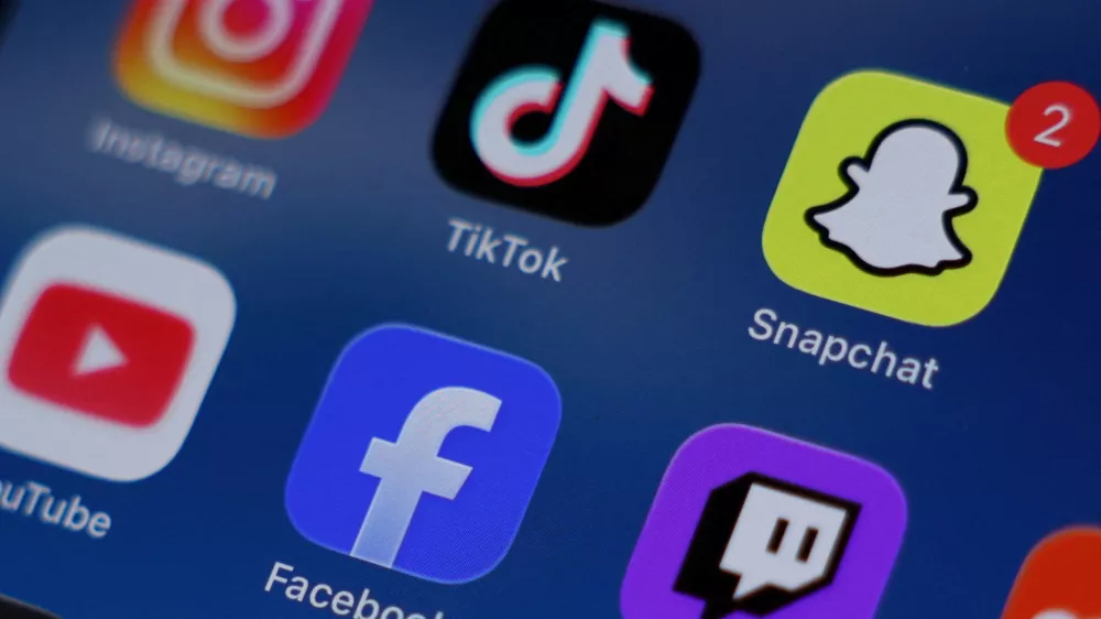 FILE PHOTO: Instagram, TikTok, Snapchat, YouTube, Facebook, Twitch and Reddit applications are displayed on a mobile phone ahead of new law banning social media for users under 16 in Australia, in this picture illustration taken on December 9, 2025. REUTERS/Hollie Adams/Illustration/File Photo