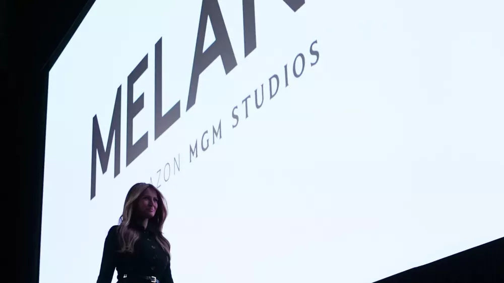 FILE - First lady Melania Trump exits the stage after speaking before the premiere of her movie "Melania" at The John F. Kennedy Memorial Center for the Performing Arts in Washington, Jan. 29, 2026. (AP Photo/Allison Robbert, File)