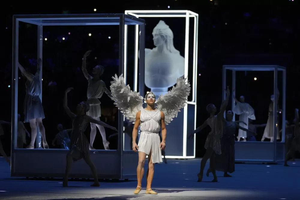 A performer prepares for the start of the Olympic opening ceremony at the 2026 Winter Olympics, in Milan, Italy, Friday, Feb. 6, 2026. (AP Photo/Natacha Pisarenko)