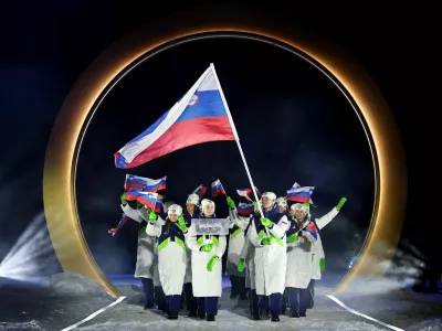 Milano Cortina 2026 Olympics - Opening Ceremony - Predazzo, Italy - February 06, 2026. Flag bearers Domen Prevc of Slovenia and Nika Prevc of Slovenia with contingent in the athletes parade during the opening ceremony REUTERS/Kai Pfaffenbach