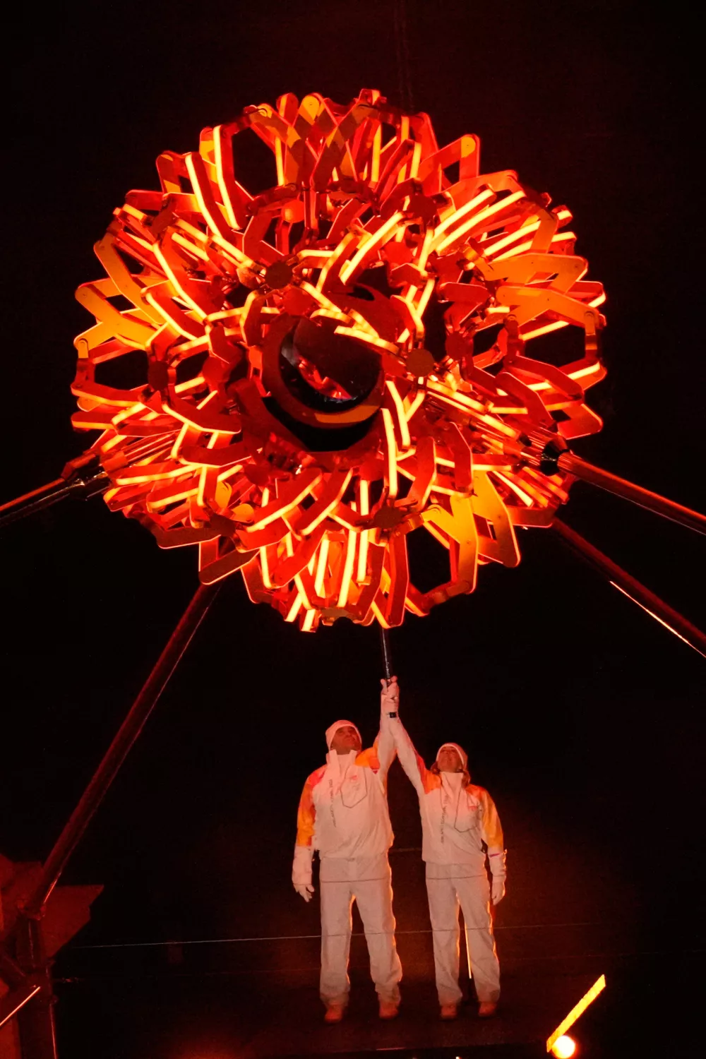 Italian former skier Deborah Compagnoni and Italian former skier Alberto Tomba light the cauldron at the Arco della Pace during the Olympic opening ceremony at the 2026 Winter Olympics, in Milan, Italy, Friday, Feb. 6, 2026. (AP Photo/Luca Bruno)