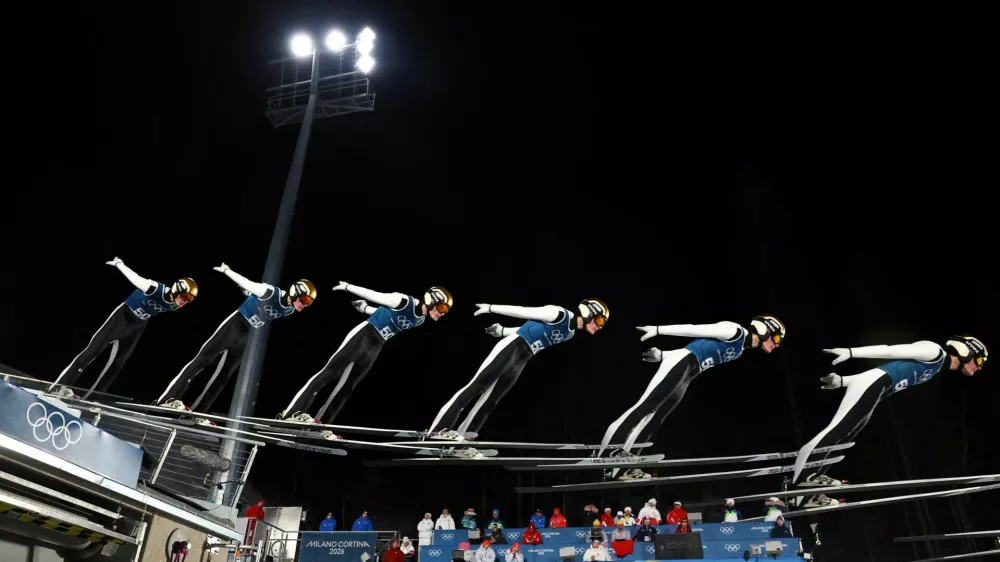 Milano Cortina 2026 Olympics - Ski Jumping - Men's Large Hill - Official Training - Predazzo Ski Jumping Stadium, Predazzo, Italy - February 12, 2026. Domen Prevc of Slovenia in action during training. This is an in-camera multiple exposure picture. REUTERS/Kai Pfaffenbach