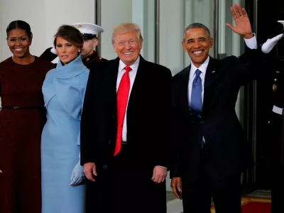 FILE PHOTO: U.S. President Barack Obama (R) and first lady Michelle Obama (L) greet U.S. President-elect Donald Trump and his wife Melania for tea before the inauguration at the White House in Washington, U.S. January 20, 2017. REUTERS/Jonathan Ernst/File Photo
