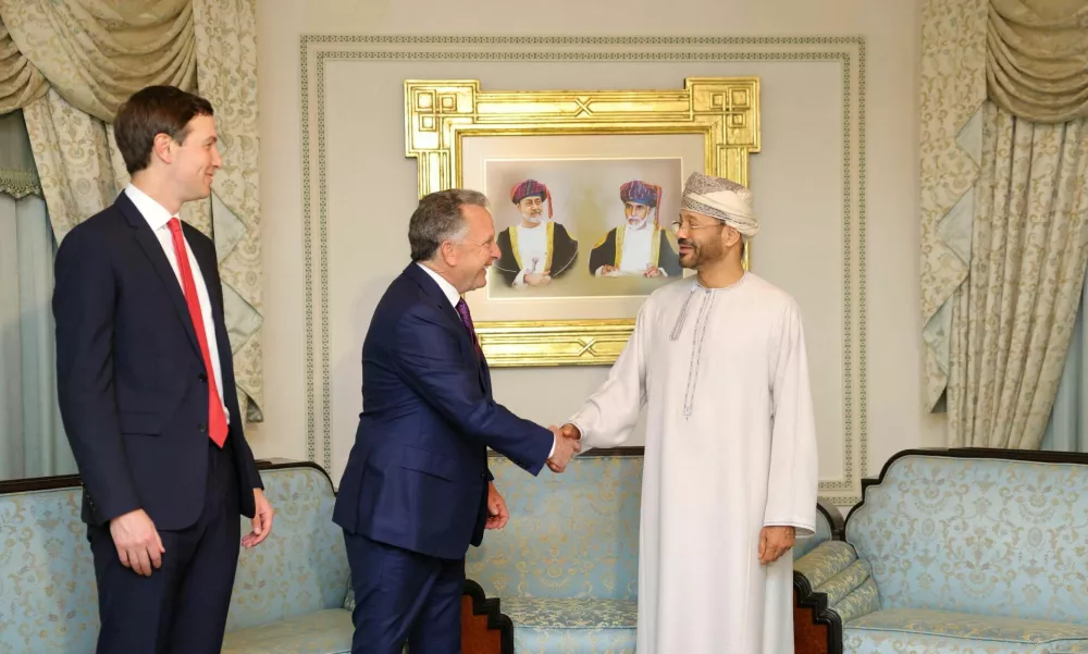 Jared Kushner looks on as U.S. Special Envoy Steve Witkoff shakes hands with Omani Foreign Minister Sayyid Badr Albusaidi in Muscat, Oman, February 6, 2026. Omani Ministry of Foreign Affairs/Handout via REUTERS ATTENTION EDITORS - THIS PICTURE WAS PROVIDED BY A THIRD PARTY.   TPX IMAGES OF THE DAY