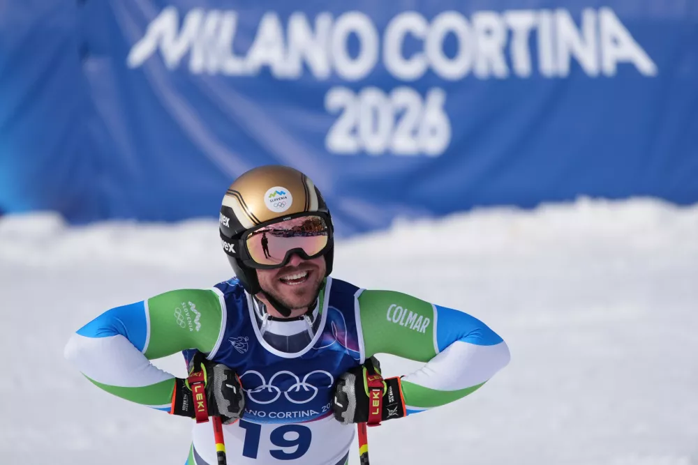 Slovenia's Miha Hrobat celebrates at the finish area of an alpine ski men's downhill race, at the 2026 Winter Olympics, in Bormio, Italy, Saturday, Feb. 7, 2026. (AP Photo/Rebecca Blackwell)