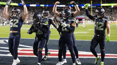 Feb 8, 2026; Santa Clara, CA, USA; Seattle Seahawks safety Julian Love (20) celebrates with teammates after intercepting the ball against the New England Patriots during the fourth quarter in Super Bowl LX at Levi's Stadium. Mandatory Credit: Kyle Terada-Imagn Images