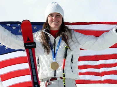 Milano Cortina 2026 Olympics - Alpine Skiing - Women's Downhill Victory Ceremony - Tofane Alpine Skiing Centre, Belluno, Italy - February 08, 2026. Gold medallist Breezy Johnson of United States celebrates after winning the women's downhill REUTERS/Leonhard Foeger