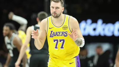 Feb 3, 2026; Brooklyn, New York, USA; Los Angeles Lakers guard Luka Doncic (77) gestures after scoring in the third quarter against the Brooklyn Nets at Barclays Center. Mandatory Credit: Wendell Cruz-Imagn Images