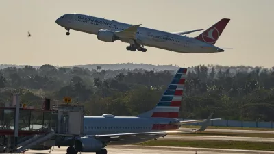 A Turkish Airlines plane takes off alongside an American Airlines plane at Jose Marti International Airport in Havana, Cuba, Monday, Feb. 9, 2026. (AP Photo/Ramon Espinosa)