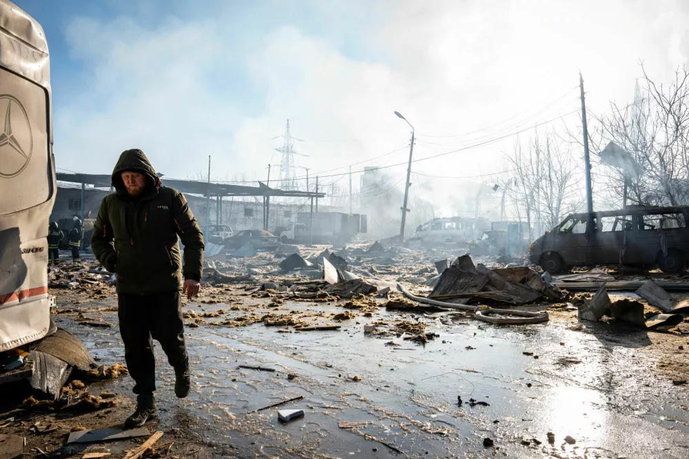 10 February 2026, Ukraine, Slovyansk: A resident walks near one of the sites hit by multiple Russian guided bombs in Slovyansk. Photo: Tommaso Fumagalli/ZUMA Press Wire/dpa