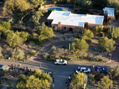 A drone view shows media staging near the home of Nancy Guthrie, the 84-year-old mother of U.S. journalist and television host Savannah Guthrie, who went missing from her home in Tucson, U.S. February 9, 2026. REUTERS/Rebecca Noble