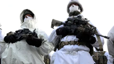 FILE PHOTO: Dutch Marines stand in front of a jet, during the visit of NATO Secretary General Jens Stoltenberg at a base, as part of a military exercise called "Cold Response 2022", gathering around 30,000 troops from NATO member countries plus Finland and Sweden, amid Russia's invasion of Ukraine, in Bardufoss in the Arctic Circle, Norway, March 25, 2022. REUTERS/Yves Herman/File Photo