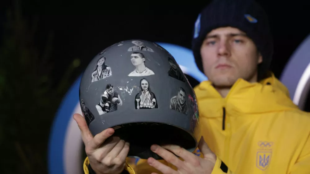 Milano Cortina 2026 Olympics - Skeleton - Vladyslav Heraskevych Press Conference - Cortina d'Ampezzo, Italy - February 10, 2026. Vladyslav Heraskevych of Ukraine displays his helmet that serves as a tribute to athletes who have died amid Russia's attack on Ukraine during the press conference REUTERS/Leonhard Foeger