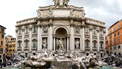 "Rome, Italy - June 2, 2010: Tourist in Rome are visiting and wishing in Fontana Di Trevi, a famous place in Rome."