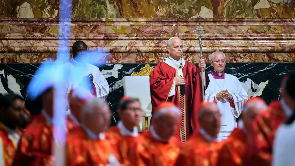 Pope Leo XIV arrives in St. Peter's Basilica at the Vatican for Mass for the repose of the soul of the late Pope Francis and deceased cardinals, Monday, Nov. 3, 2025. (AP Photo/Andrew Medichini)