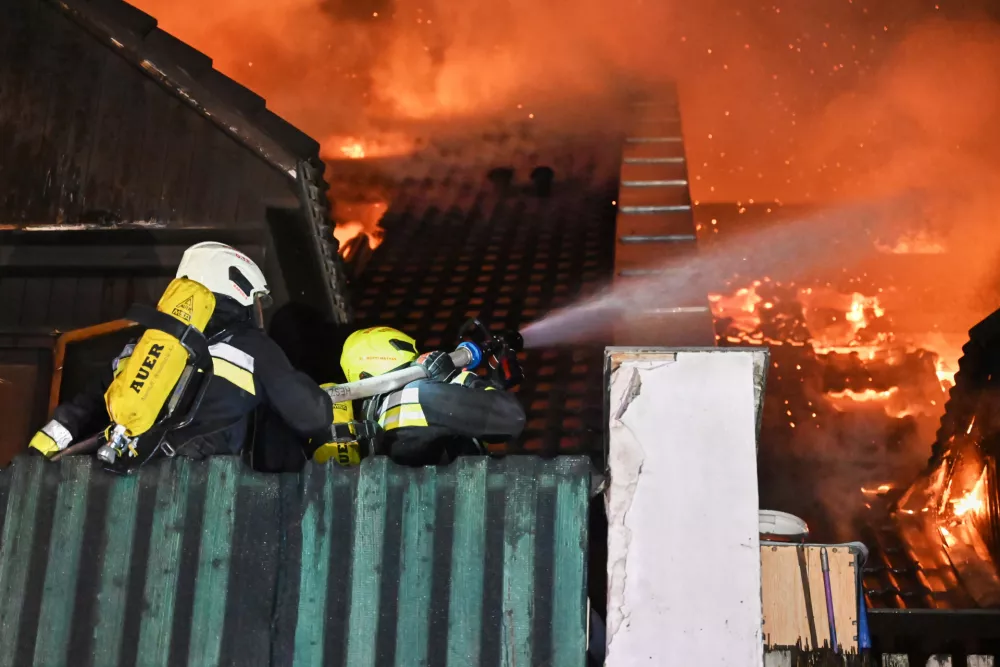 This image released on Friday, Feb. 13, 2026 by Hungary's National Directorate General for Disaster Management shows firefighters working to extinguish a fire that authorities in Hungary say left people dead and injured in Budakeszi, a suburb of the capital Budapest. (Hungary's National Directorate General for Disaster Management via AP)