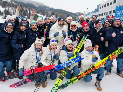 Heidi Weng, Karoline Simpson-Larsen, Astrid Oeyre Slind, and Kristin Austgulen Fosnaes, of Norway, pose with their team after winning the gold medal in the cross country skiing women's 4 x 7.5km relay at the 2026 Winter Olympics, in Tesero, Italy, Saturday, Feb. 14, 2026. (AP Photo/Matthias Schrader)