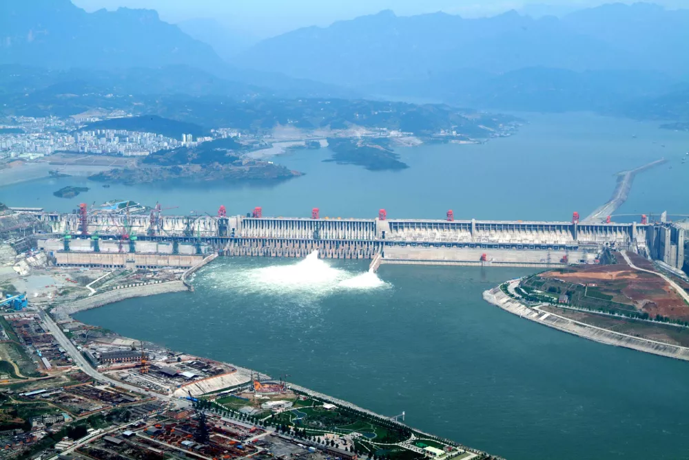 This photo taken on Sunday May 14, 2006 and released by China's official Xinhua news agency, shows a distant view of the giant dam of the Three Gorges hydropower project under construction on the Yangtze River. There are less than 3,000 cubic meters of concrete left to be placed before the dam is finally completed on May 20, nine months ahead of the schedule, Xinhua said. The dam is situated near the Xiling Gorge, the eastern most gorge of the Three Gorges on the middle reaches of the Yangtze River. (AP Photo/Xinhua, Du Huaju)
