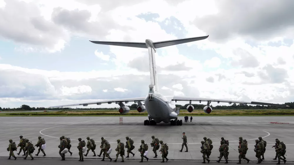 Russian paratroopers walk before boarding Ilyushin Il-76 transport planes as they take part in the military exercises "Zapad-2021" staged by the armed forces of Russia and Belarus at an aerodrome in Kaliningrad Region, Russia, September 13, 2021. REUTERS/Vitaly Nevar