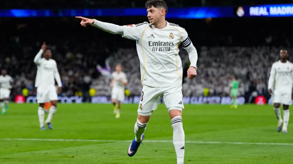 Real Madrid's Federico Valverde celebrates scoring his side's 3rd goal during the Spanish La Liga soccer match between Real Madrid and Real Sociedad in Madrid, Spain, Saturday, Feb. 14, 2026. (AP Photo/Manu Fernandez)