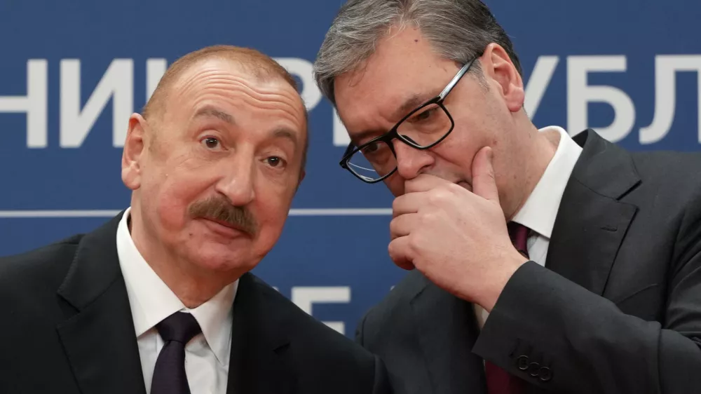 Azerbaijan President Ilham Aliyev, left, speaks with Serbian President Aleksandar Vucic during a news conference in the Serbia Palace in Belgrade, Serbia, Sunday, Feb. 15, 2026. (AP Photo/Darko Vojinovic)