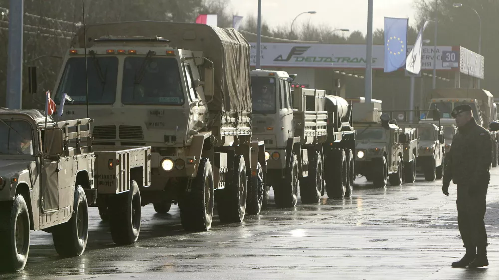 U.S. Army vehicles cross the Polish border in Olszyna, Poland, Thursday, Jan. 12, 2017 heading for their new base in Zagan. First U.S. troops arrive in Zagan in western Poland as part of deterrence force of some 1,000 troops to be based here and reassure Poland that is worried about Russia's activity. (AP Photo/Czarek Sokolowski)