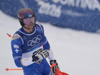 Greece's Aj Ginnis arrives at the finish area of an alpine ski, men's slalom race, at the 2026 Winter Olympics, in Bormio, Italy, Monday, Feb. 16, 2026. (AP Photo/Rebecca Blackwell)