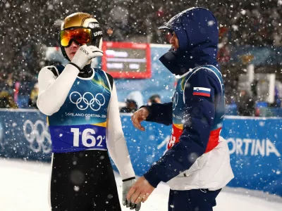 Milano Cortina 2026 Olympics - Ski Jumping - Men's Super Team - Predazzo Ski Jumping Stadium, Predazzo, Italy - February 16, 2026. Domen Prevc of Slovenia and Anze Lanisek of Slovenia during the final round REUTERS/Kacper Pempel