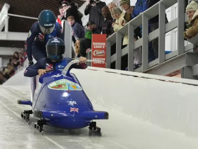 Britain's Adele Nicoll and Ashleigh Nelson, of the United States, start their first run of the 2-woman bobsled race during the bobsled world championships, Friday, March 14, 2025, in Lake Placid, N.Y. (AP Photo/Seth Wenig)