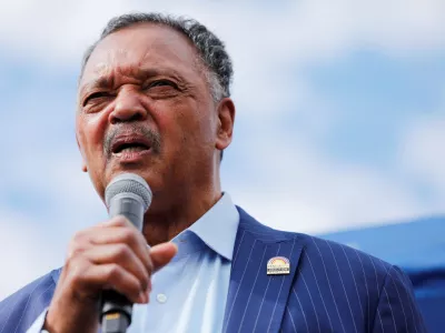 FILE PHOTO: Reverend Jesse Jackson speaks to protesters who gathered to memorialize George Floyd, who died in Minneapolis police custody, at the scene of his arrest in Minneapolis, Minnesota, U.S. June 4, 2020. REUTERS/Adam Bettcher/File Photo