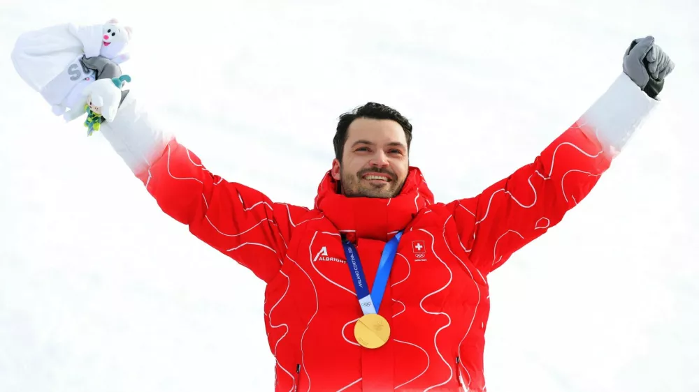 Milano Cortina 2026 Olympics - Alpine Skiing - Men's Slalom Victory Ceremony - Stelvio Ski Centre, Bormio, Italy - February 16, 2026. Gold medallist Loic Meillard of Switzerland celebrates on the podium during the men's slalom victory ceremony REUTERS/Denis Balibouse