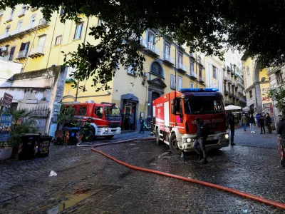 Firetrucks stand next to the historic wood-framed Teatro Sannazaro damaged by fire, in Naples, Italy, February 17, 2026. REUTERS/Ciro De Luca