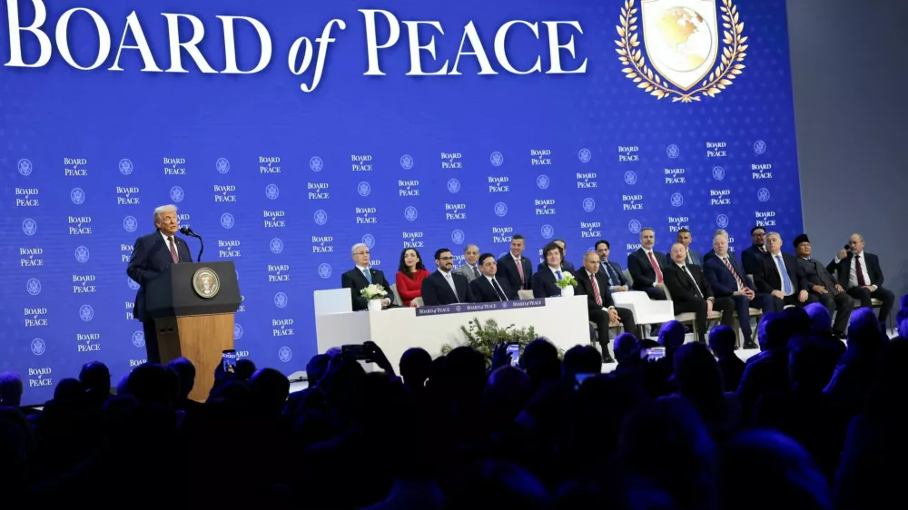 FILE PHOTO: U.S. President Donald Trump speaks during a charter announcement for his Board of Peace initiative aimed at resolving global conflicts, alongside the 56th annual World Economic Forum (WEF), in Davos, Switzerland, January 22, 2026. REUTERS/Jonathan Ernst/File Photo