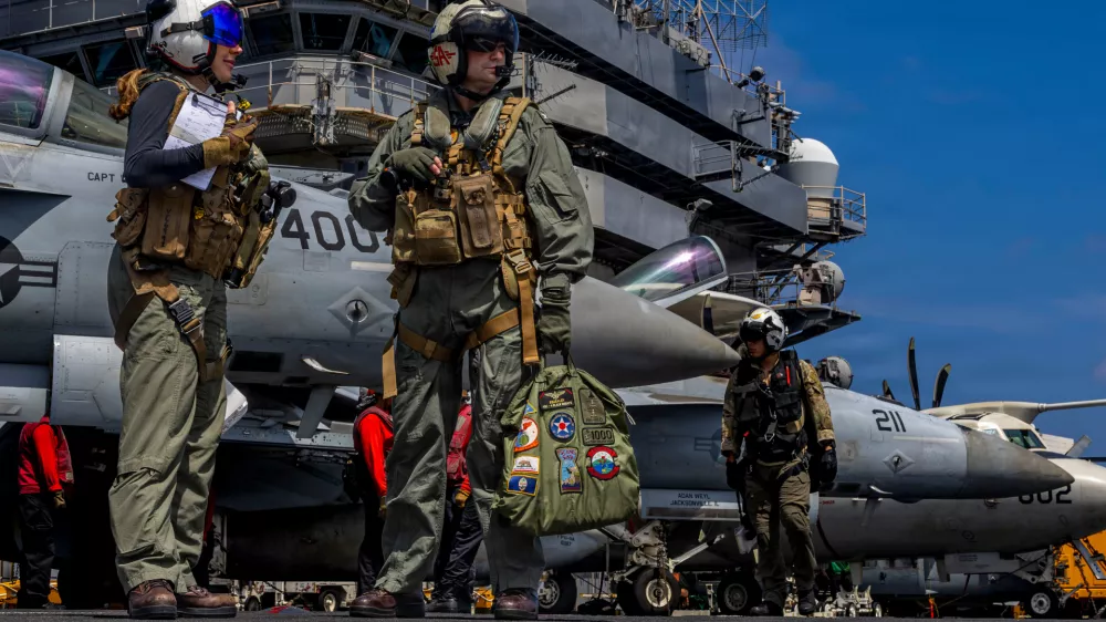 This handout image from the U.S. Navy shows Capt. Daniel Keeler, the commanding officer of the Nimitz-class aircraft carrier USS Abraham Lincoln, as he prepares to fly an MH-60R Sea Hawk helicopter in the Indian Ocean on Jan. 23, 2026. (Mass Communication Specialist Seaman Daniel Kimmelman/U.S. Navy via AP)