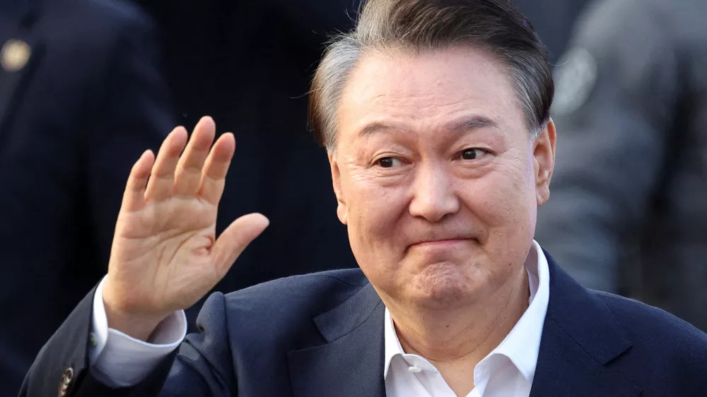 FILE PHOTO: South Korean impeached President Yoon Suk Yeol reacts outside the Seoul detention center after his release, in Uiwang, South Korea, March 8, 2025. REUTERS/Kim Hong-ji/File Photo