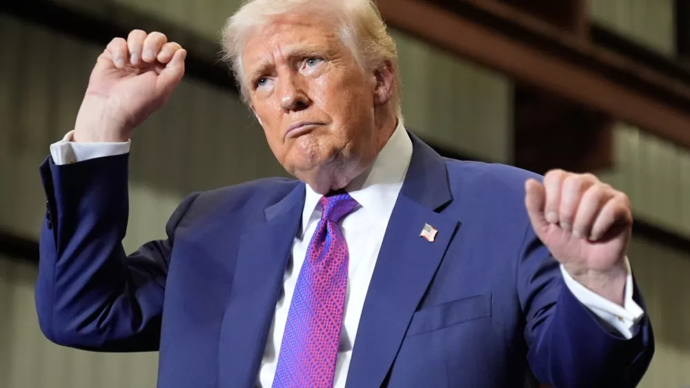 President Donald Trump dances after speaking at Coosa Steel Corporation in Rome, Ga., Thursday, Feb. 19, 2026. (AP Photo/Mark Schiefelbein)