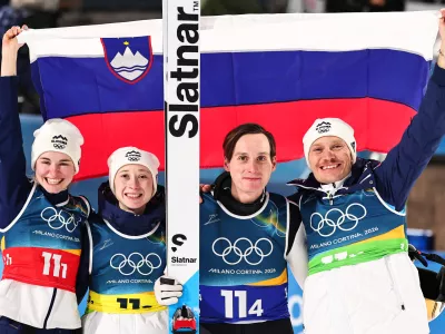 10 February 2026, Italy, Predazzo: (L-R) Slovenia's Nika Vodan, Nika Prevc, Domen Prevc and Anze Lanisek celebrate after the Ski Jumping Mixed team competition of the 2026 Winter Olympic Games at Milan-Cortina. Photo: Daniel Karmann/dpa
