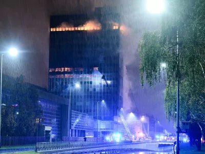 Firefighters work to extinguish the fire that caught 'Vjesnik' skyscraper, which used to accommodate most of Croatian media companies, in Zagreb, Croatia, early Tuesday, Nov. 18, 2025. (AP Photo/Damir Krajac)