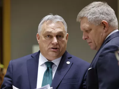 Slovakia's Prime Minister Robert Fico, right, talks to Hungary's Prime Minister Viktor Orban during a round table meeting at an EU summit in Brussels, Thursday, Feb. 1, 2024. European Union leaders meet in Brussels for a one day summit to discuss the revision of the Multiannual Financial Framework 2021-2027, including support for Ukraine. (AP Photo/Geert Vanden Wijngaert)