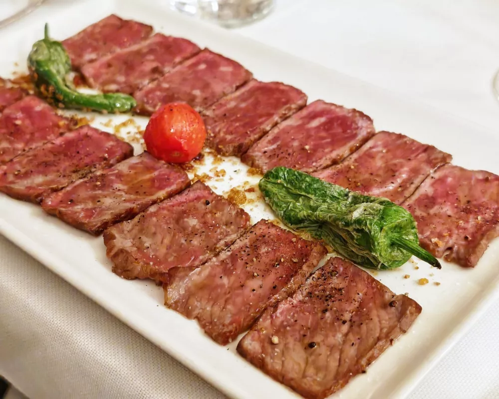 Taljata nevio, Gostilna As