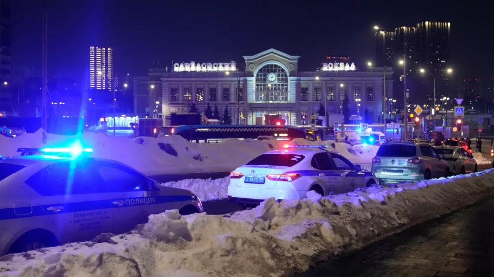 Police and emergency services are seen at the scene of an attack on a police patrol near the Savyolovsky Railway Station, in Moscow, Tuesday, Feb. 24, 2026. (AP Photo)