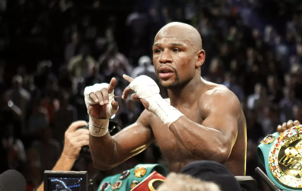Undefeated WBC welterweight champion Floyd Mayweather Jr. of the U.S. celebrates his victory over Robert Guerrero, also of the U.S., at the MGM Grand Garden Arena in Las Vegas, Nevada May 4, 2013. REUTERS/Steve Marcus (UNITED STATES - Tags: SPORT BOXING)