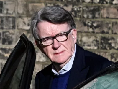 FILE PHOTO: Former British Ambassador to the U.S. Peter Mandelson enters a vehicle outside a reported residence, after police launched a misconduct in public office investigation following the release of U.S. Justice Department files linked to the late financier and convicted sex offender Jeffrey Epstein, in London, Britain, February 14, 2026. REUTERS/Chris Ratcliffe/File Photo