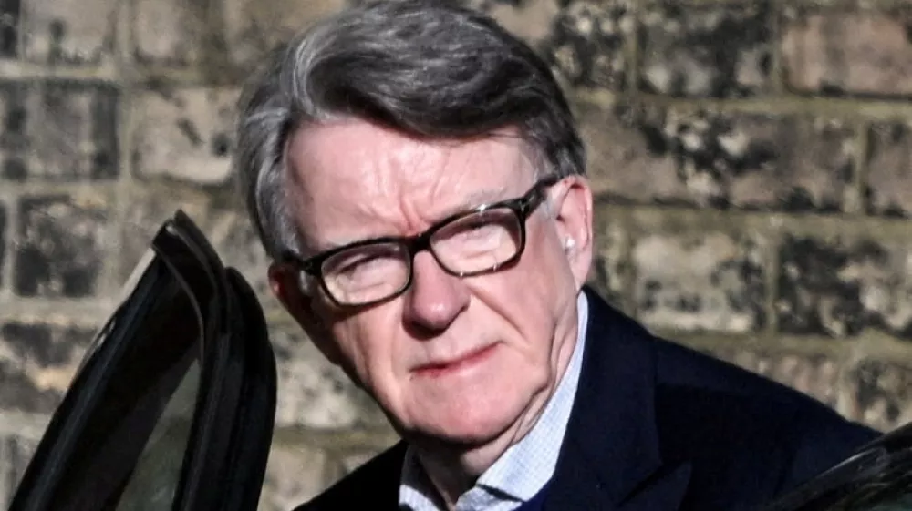 FILE PHOTO: Former British Ambassador to the U.S. Peter Mandelson enters a vehicle outside a reported residence, after police launched a misconduct in public office investigation following the release of U.S. Justice Department files linked to the late financier and convicted sex offender Jeffrey Epstein, in London, Britain, February 14, 2026. REUTERS/Chris Ratcliffe/File Photo