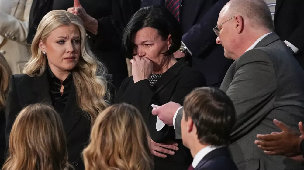 Anna Zarutska, the mother of Iryna Zarutska, is recognized by President Donald Trump during his State of the Union address to a joint session of Congress in the House chamber at the U.S. Capitol in Washington, Tuesday, Feb. 24, 2026, as Erika Kirk watches at left. (AP Photo/Matt Rourke)