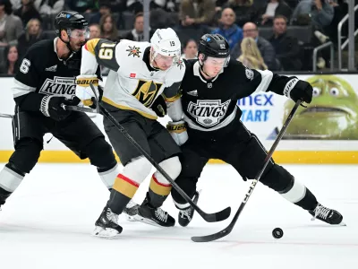 Vegas Golden Knights right wing Reilly Smith (19) battles Los Angeles Kings defenseman Joel Edmundson (6) and defenseman Brandt Clarke (92) for the puck in the third period of an NHL hockey game Wednesday, Feb. 25, 2026, in Los Angeles. (AP Photo/Wally Skalij)