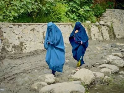 FILE PHOTO: Afghan women in burqa walk towards a safer place after their house was damaged following a deadly magnitude 6 earthquake that struck Afghanistan on Sunday, at Lulam village, in Nurgal district, Kunar province, Afghanistan, September 3, 2025. REUTERS/Sayed Hassib/File Photo