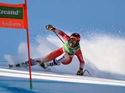 Switzerland's Corinne Suter speeds down the course during an alpine ski, women's World Cup downhill training, in Soldeu, Andorra, Thursday, February. 26, 2026. (AP Photo/Marco Trovati)