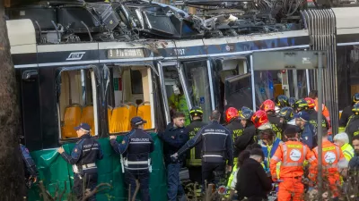 Rescuers and police officers work at the scene of a derailment on Line 9 in Milan, Italy, Friday, Feb. 27, 2026. (Stefano Porta/LaPresse via AP)